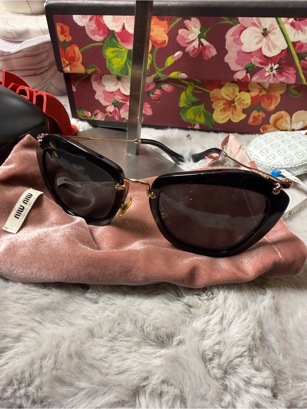 Miu Miu Black Cat-Eye Sunglasses with Gold Trim